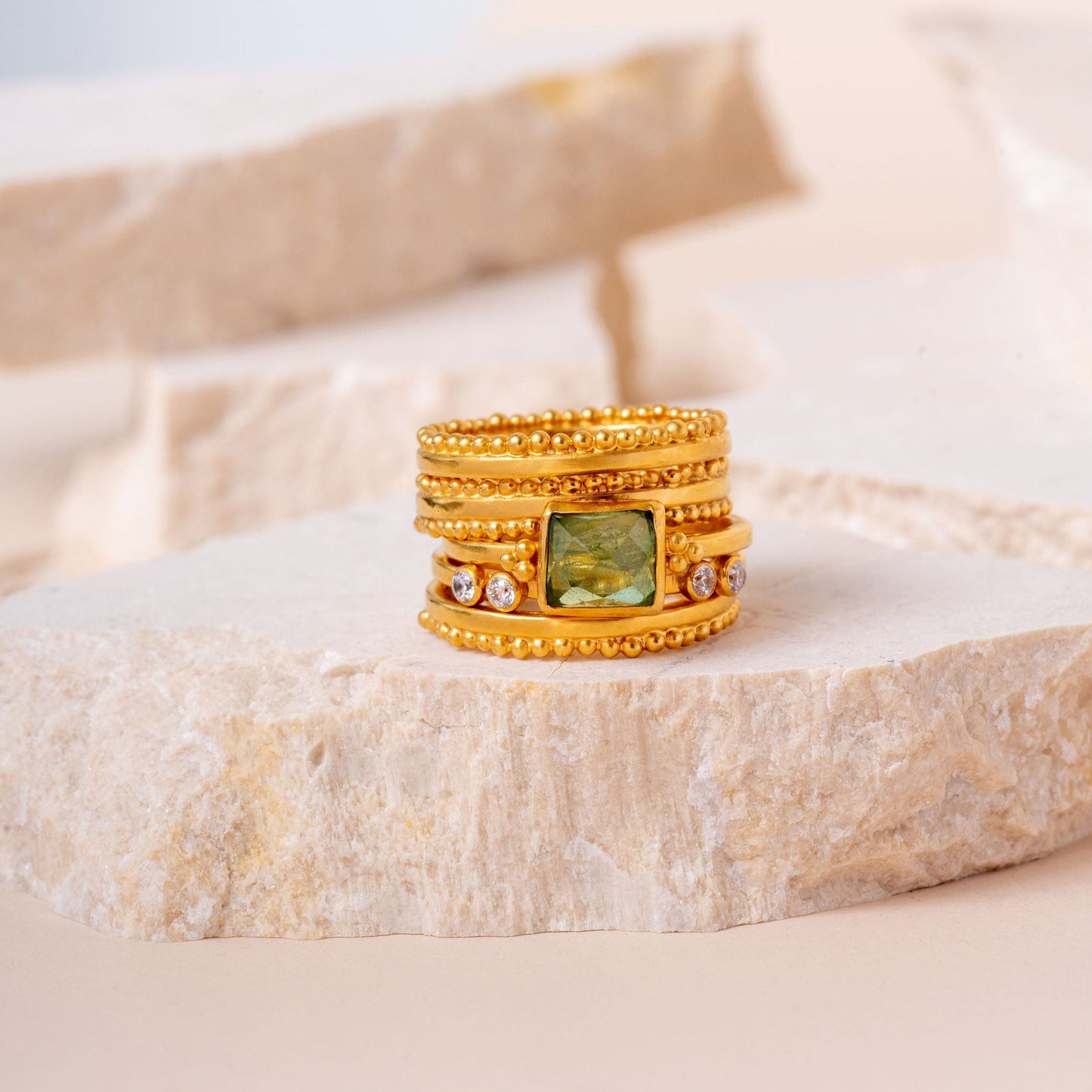 Gold statement ring with top and bottom granulation.