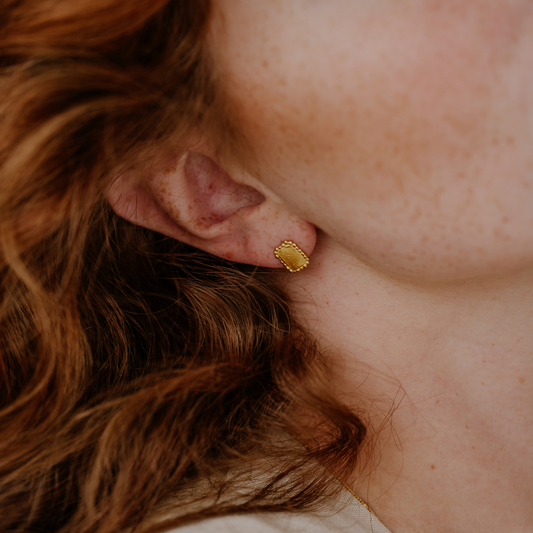 Everyday essentials with a touch of elegance, these small studs boast a rich gold colour and organic textures.