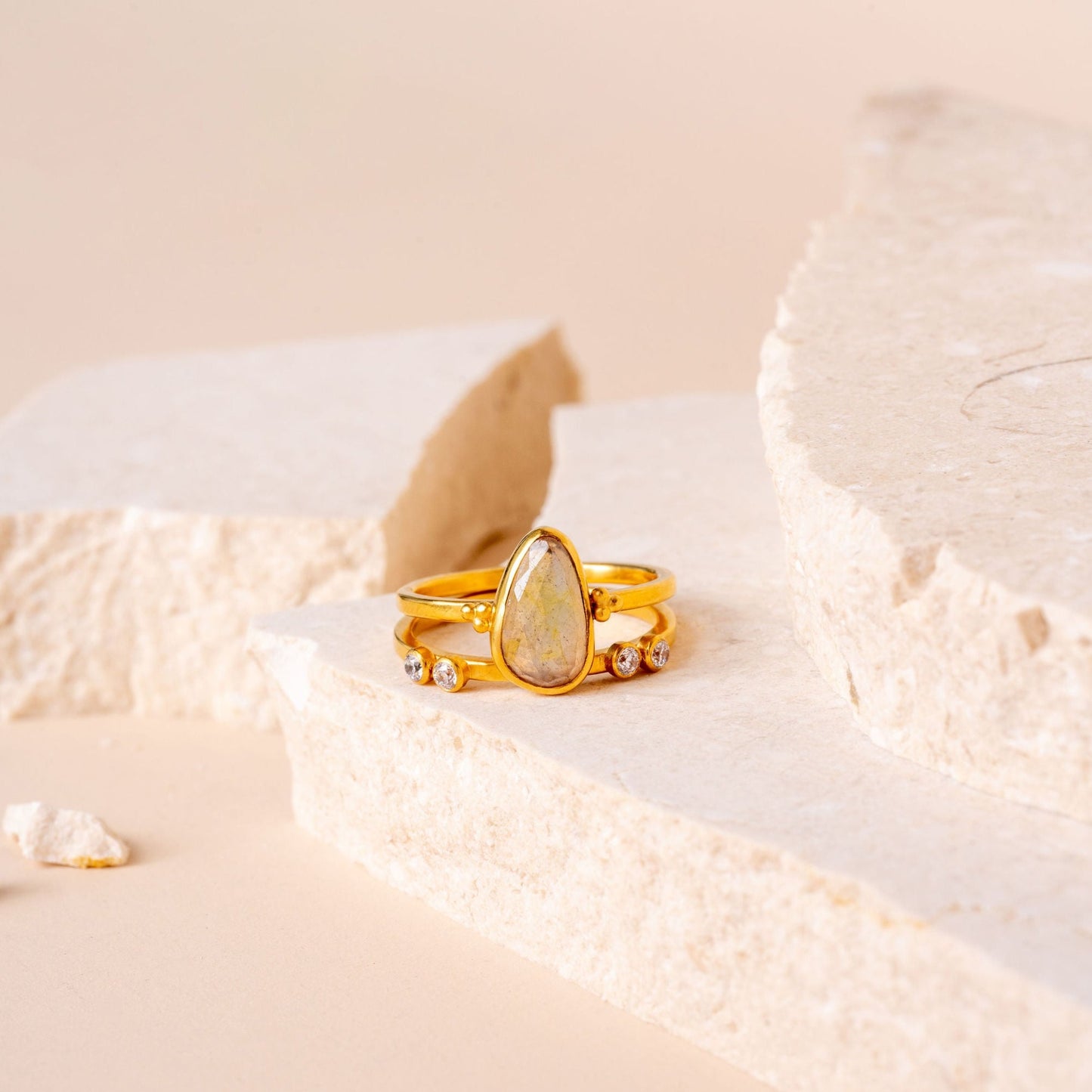 Artisanal gold ring with granulation detailing, complemented by a beautiful light yellow teardrop sapphire."