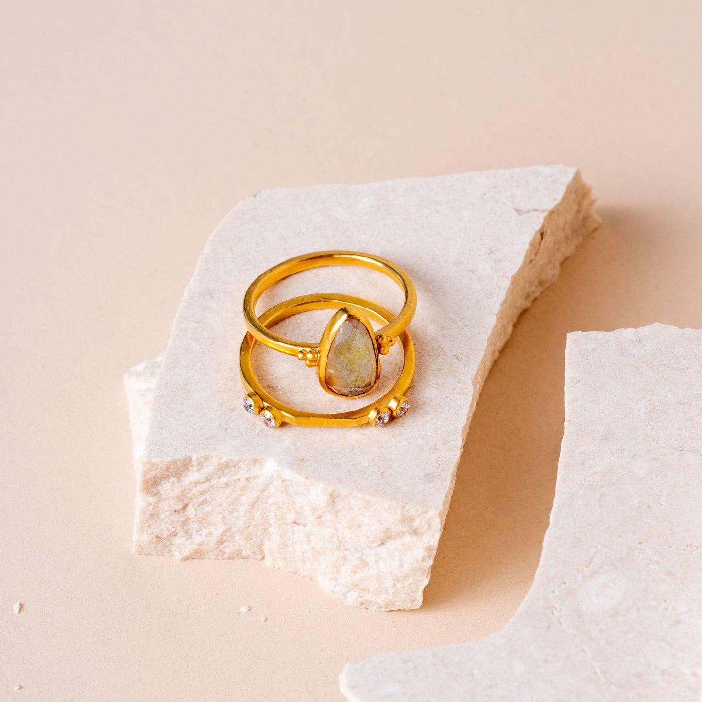 Artisan ring design with meticulous granulation framing a captivating light yellow teardrop sapphire.