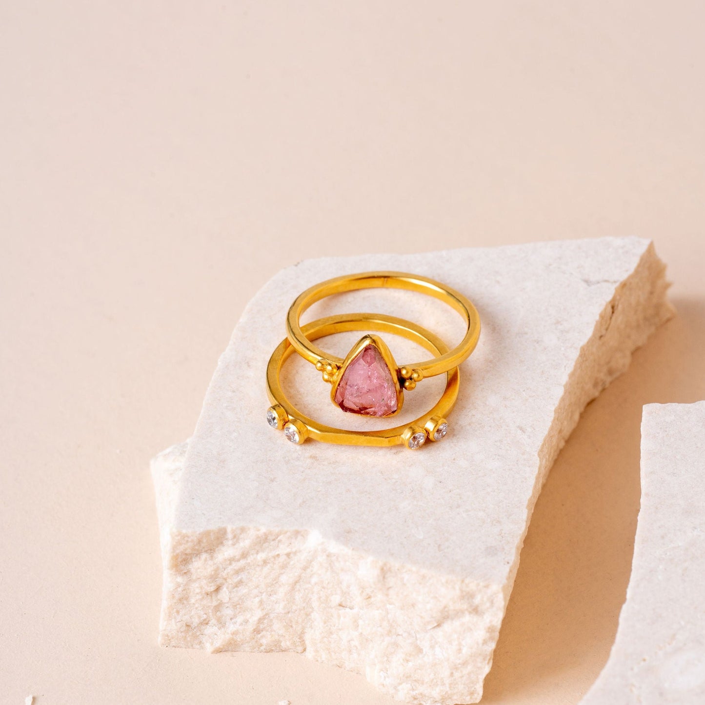 gold ring featuring a pink tourmaline gem and delicate granulation for a touch of sophistication.