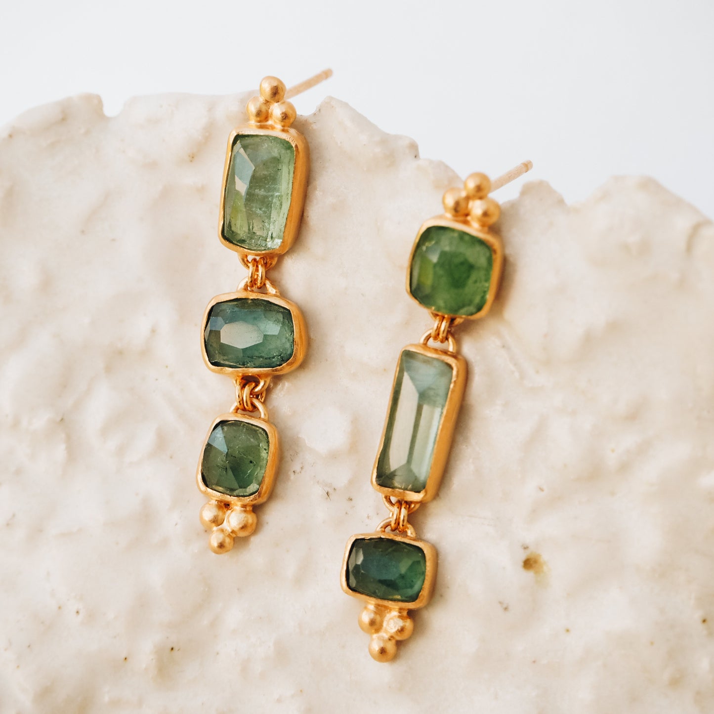 One-of-a-kind gold earrings with dainty square rose cut tourmaline gemstone drops in ocean blue and green, adorned with intricate granulation accents.