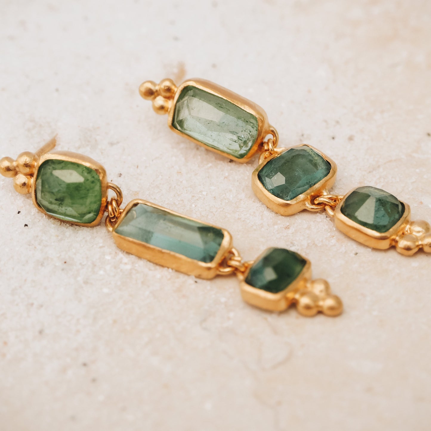 Gold gemstone drop earrings featuring one-of-a-kind square rose cut tourmaline in ocean blue and green, intricately accented with granulation