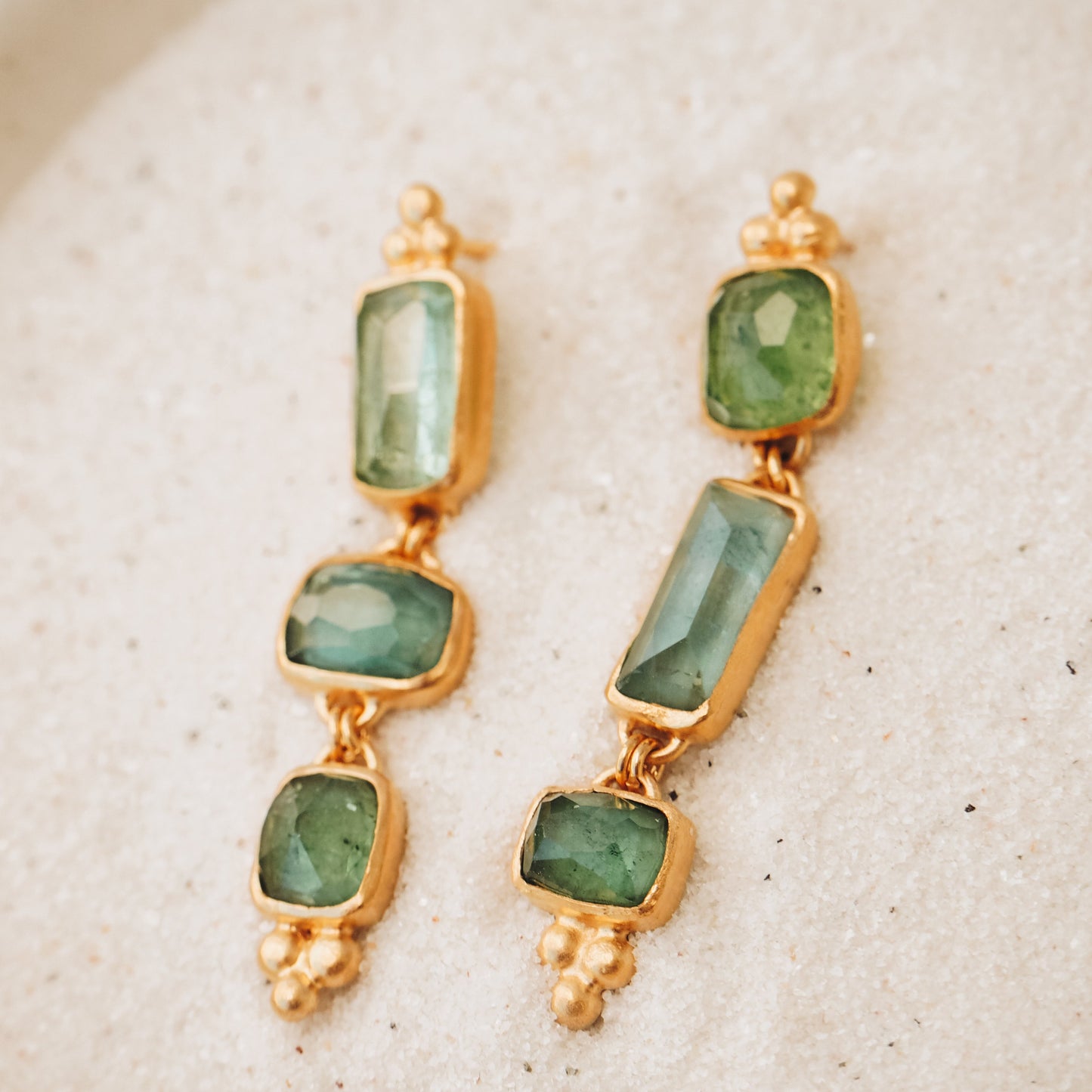 Gold gemstone drop earrings with one-of-a-kind square rose cut tourmaline in ocean blue and green, intricately detailed with granulation for a unique and captivating look.