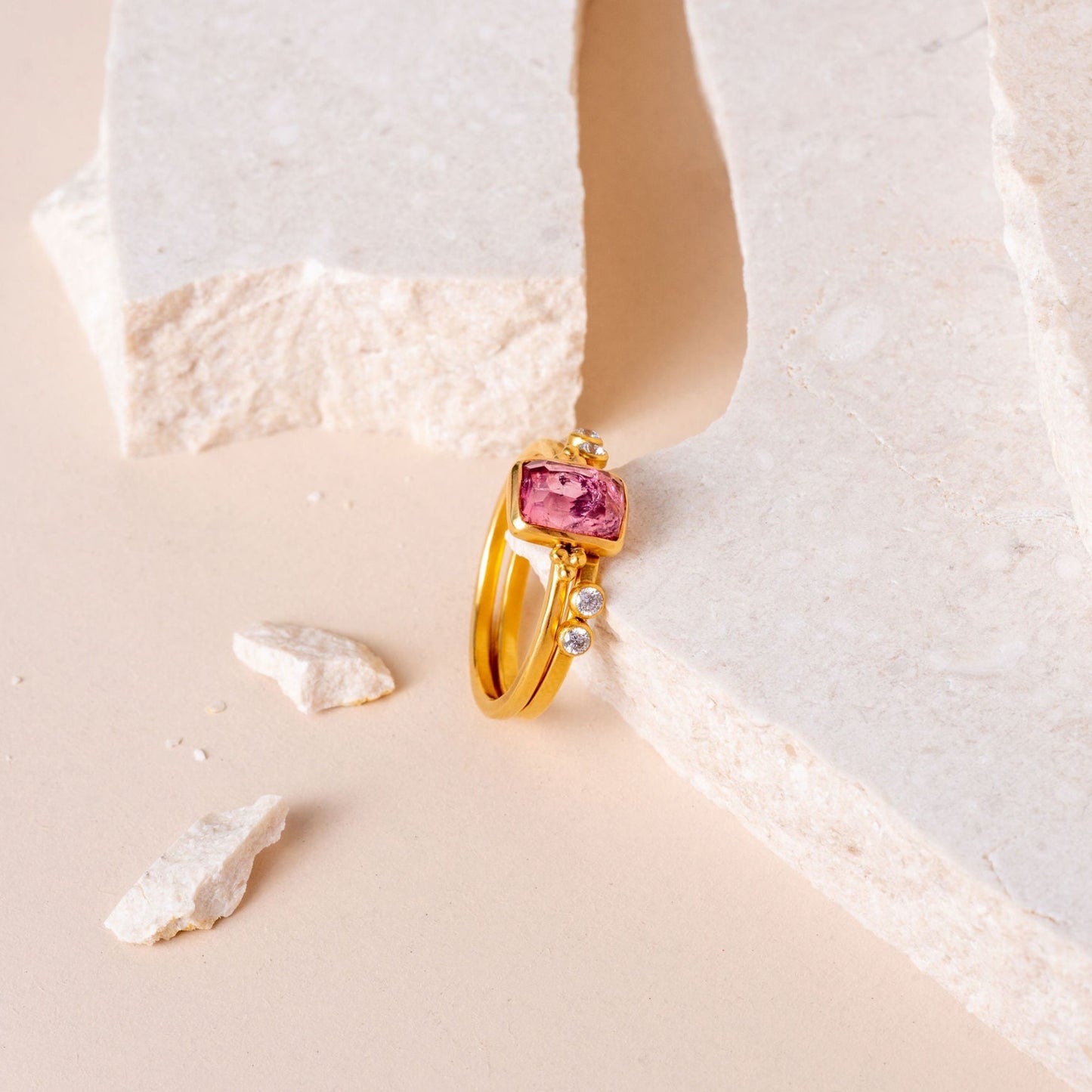 Artisanal ring design with intricate granulation complementing an organic hand-cut pink tourmaline.
