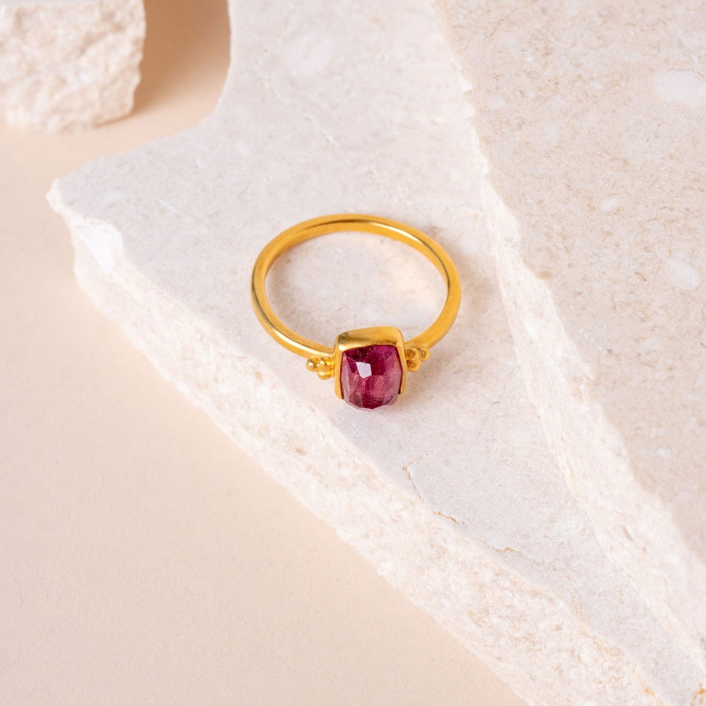 Delicate gold vermeil ring with hand-cut pink tourmaline, accentuated by artisanal granulation details.