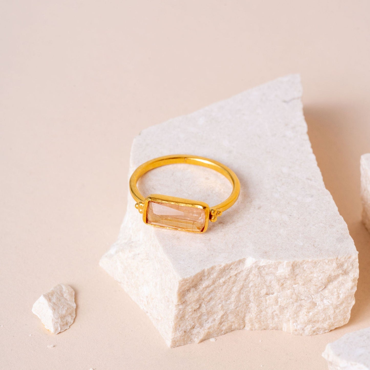 Handcrafted gold ring featuring a sunset-inspired rectangular tourmaline.