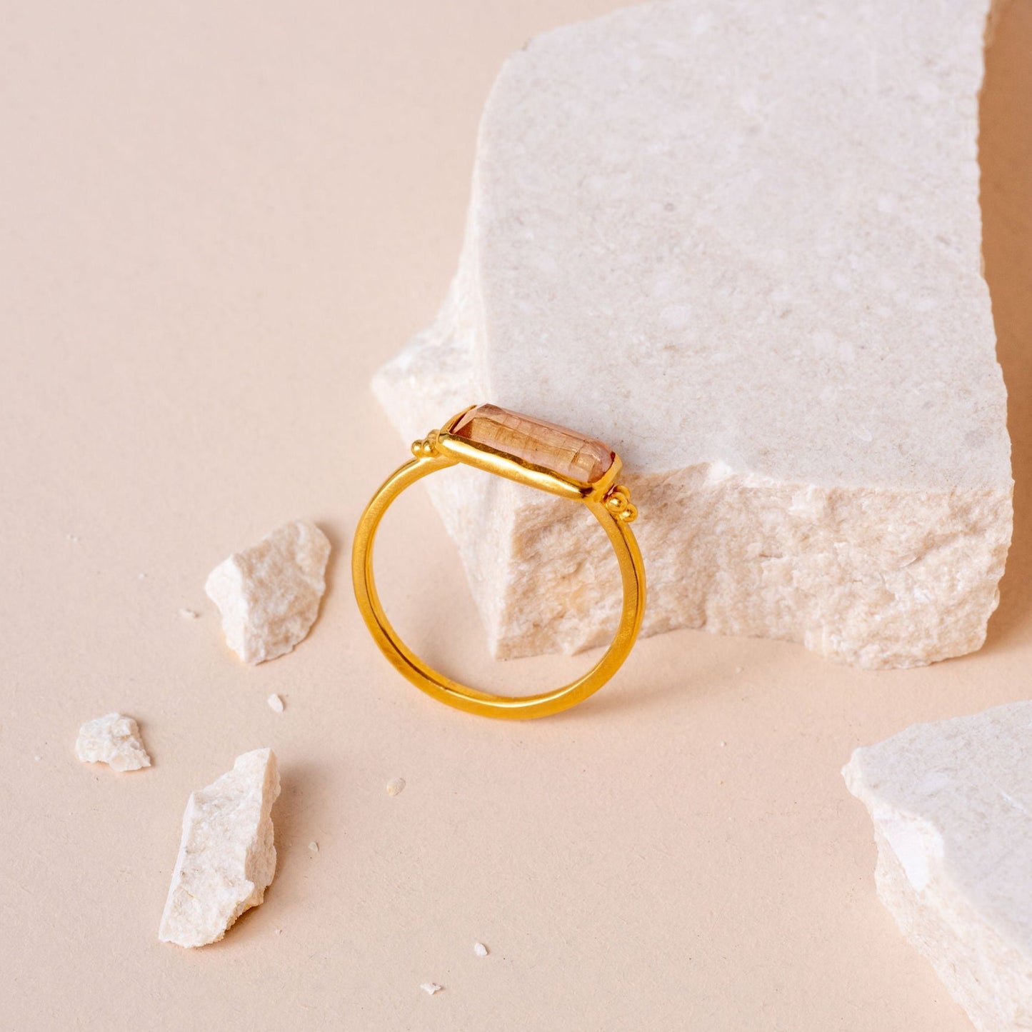 Exquisite gold ring showcasing a hand-cut rectangular tourmaline.