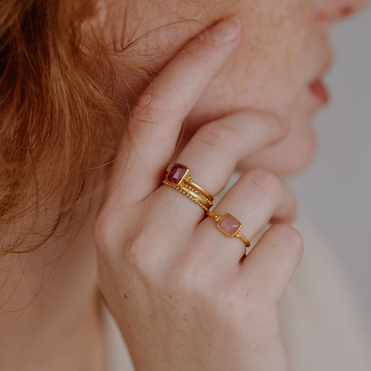 Artisan ring in rich gold with intricate granulation and a charming light pink square tourmaline.