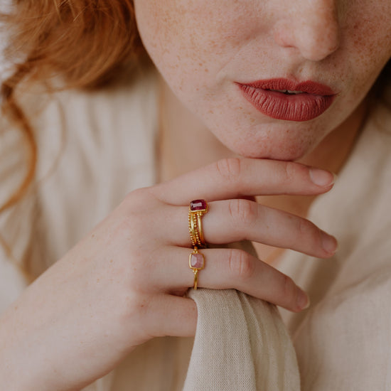 Elegant handcrafted gold ring with delicate granulation and a charming light pink tourmaline.