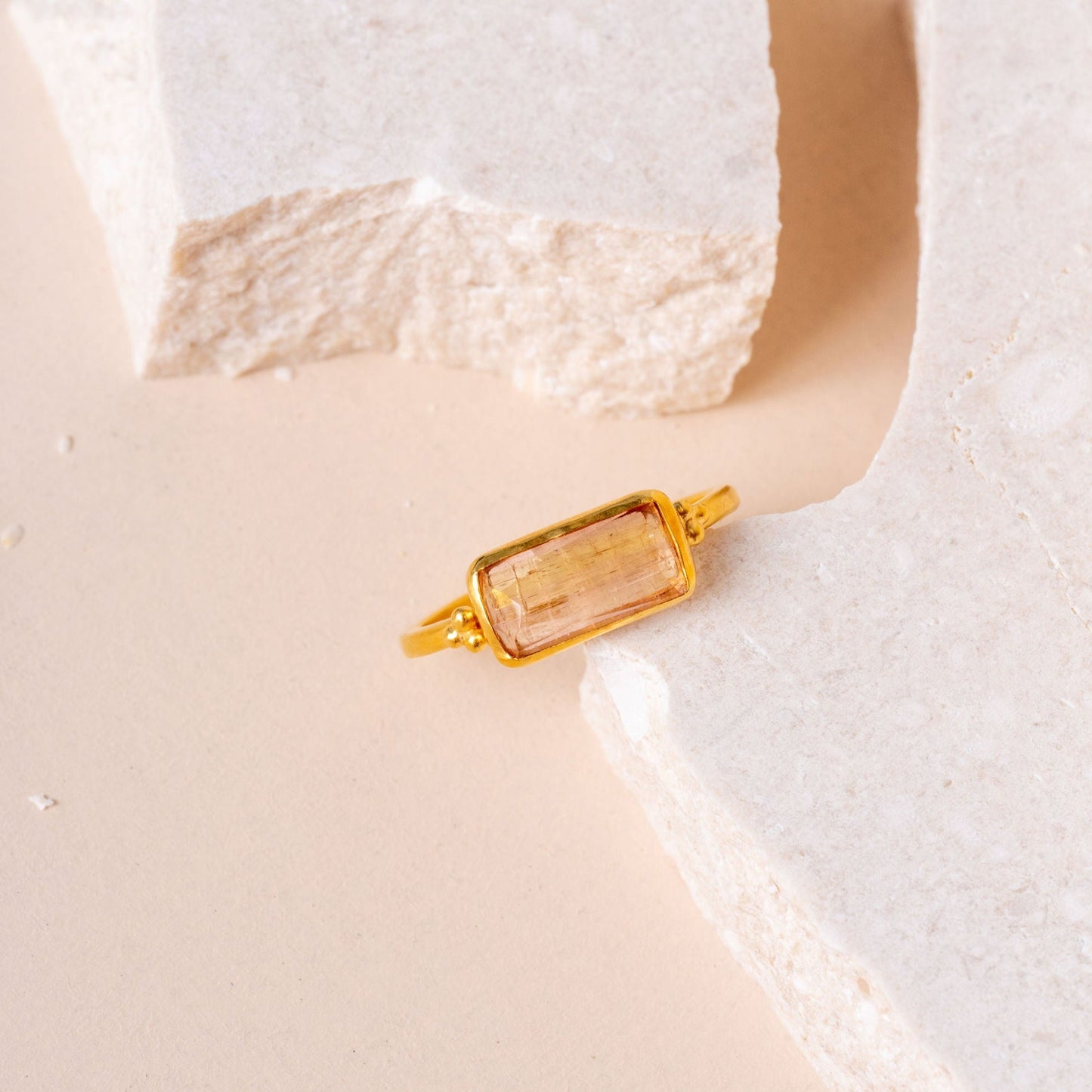 Handmade gold ring adorned with a one-of-a-kind light yellow tourmaline.